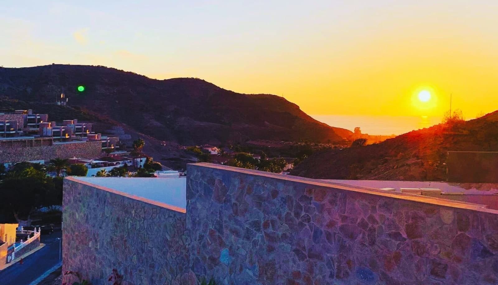 Rooftop terrace at sunset with a view over the Atlantic